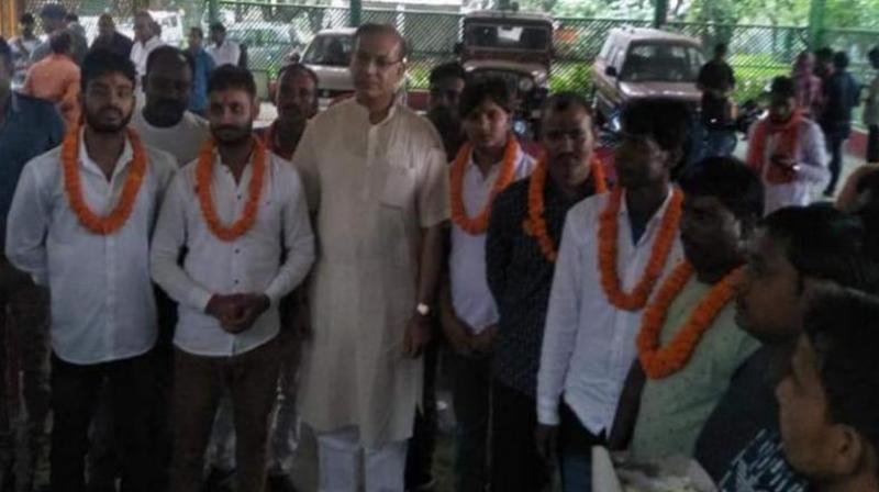 On July 6, a photograph went viral in which the minister was seen garlanding eight convicts out on bail in a lynching and murder case. (Photo: File) On July 6, a photograph went viral in which the minister was seen garlanding eight convicts out on bail in a lynching and murder case. (Photo: File)