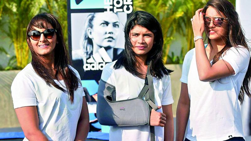Wrestler Geeta Phogat (left) along with boxer Nikhat Zareen and squash player Dipika Pallikal during a promotional event in Mumbai. (Photo: AP) Wrestler Geeta Phogat (left) along with boxer Nikhat Zareen and squash player Dipika Pallikal during a promotional event in Mumbai. (Photo: AP)