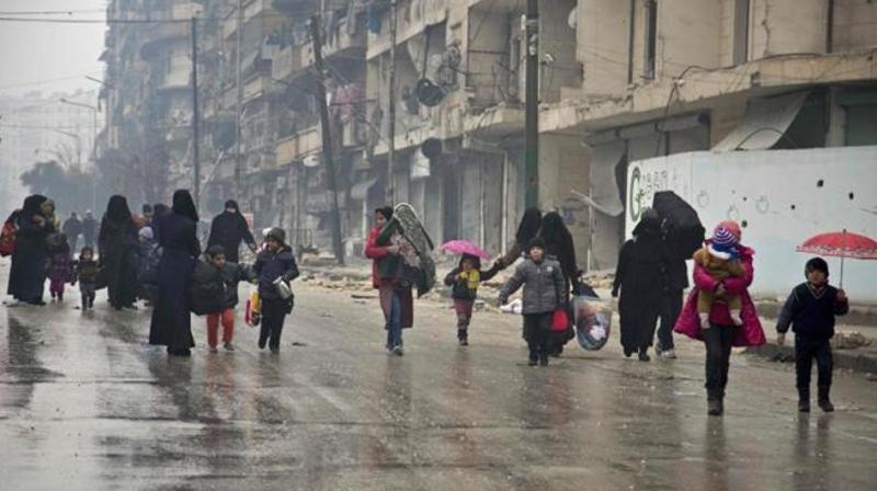 Syrians leave a rebel-held area of Aleppo towards the government-held side on Tuesday during an operation by Syrian government forces to retake the embattled city. (Photo: AFP) Syrians leave a rebel-held area of Aleppo towards the government-held side on Tuesday during an operation by Syrian government forces to retake the embattled city. (Photo: AFP)