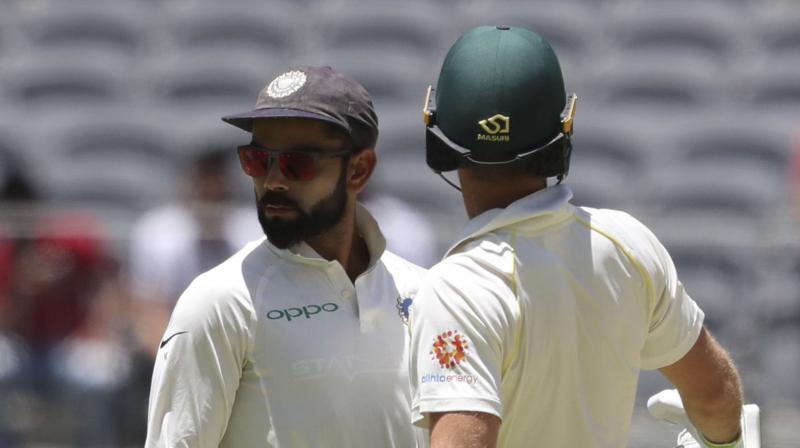 Virat Kohli and Australian skipper Tim Paine exchanged barbs, at one point prompting intervention from the umpire, during the Perth Test that Australia won by 146 runs on Tuesday to level the four-match series 1-1. (Photo: AP) Virat Kohli and Australian skipper Tim Paine exchanged barbs, at one point prompting intervention from the umpire, during the Perth Test that Australia won by 146 runs on Tuesday to level the four-match series 1-1. (Photo: AP)