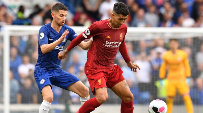 Leaders Liverpool maintained their perfect start to the Premier League season as first-half goals from Trent Alexander-Arnold and Roberto Firmino secured a 2-1 win at Chelsea on Sunday that left them five points clear at the summit. (Photo:AFP) Leaders Liverpool maintained their perfect start to the Premier League season as first-half goals from Trent Alexander-Arnold and Roberto Firmino secured a 2-1 win at Chelsea on Sunday that left them five points clear at the summit. (Photo:AFP)