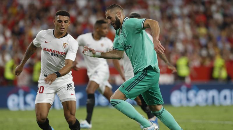 Karim Benzema headed in the decisive goal at the Ramon Sanchez Pizjuan to secure an impressive victory against a Sevilla side that were unbeaten and hoping to return to the top of the table. (Photo:AP) Karim Benzema headed in the decisive goal at the Ramon Sanchez Pizjuan to secure an impressive victory against a Sevilla side that were unbeaten and hoping to return to the top of the table. (Photo:AP)