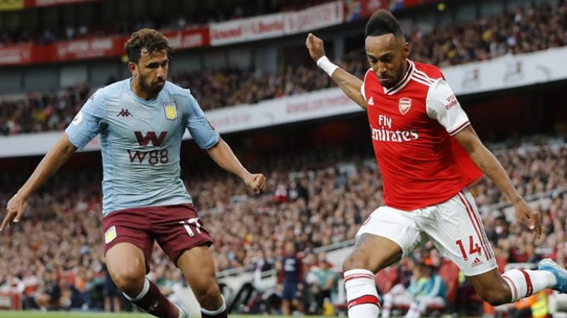Ten-man Arsenal twice came from a goal down to claim a much-needed 3-2 win over Aston Villa in dramatic fashion thanks to Pierre-Emerick Aubameyang's free-kick six minutes from time at the Emirates on Sunday. (Photo:AFP) Ten-man Arsenal twice came from a goal down to claim a much-needed 3-2 win over Aston Villa in dramatic fashion thanks to Pierre-Emerick Aubameyang's free-kick six minutes from time at the Emirates on Sunday. (Photo:AFP)