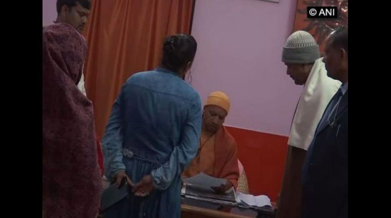 Uttar Pradesh Chief Minister Yogi Adityanath on Monday held a 'Janta Darbar' at the Gorakhnath Temple here to address grievances of people. (Photo: ANI) Uttar Pradesh Chief Minister Yogi Adityanath on Monday held a 'Janta Darbar' at the Gorakhnath Temple here to address grievances of people. (Photo: ANI)