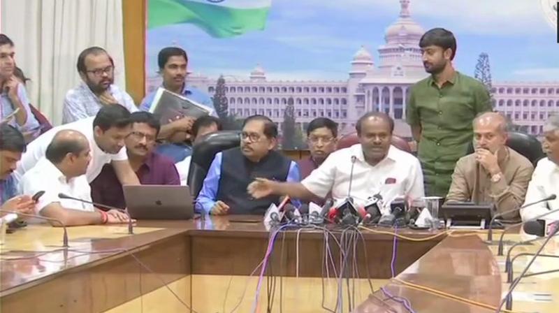 Karnataka CM HD Kumaraswamy releases an audio clip of a conversation allegedly between BJP State Chief BS Yeddyurappa and JDS MLA Naganagowda Kandkur's son Sharana where Yeddyurappa made an offer Rs 25 lakh and ministerial post for his father. (Photo: ANI | Twitter) Karnataka CM HD Kumaraswamy releases an audio clip of a conversation allegedly between BJP State Chief BS Yeddyurappa and JDS MLA Naganagowda Kandkur's son Sharana where Yeddyurappa made an offer Rs 25 lakh and ministerial post for his father. (Photo: ANI | Twitter)