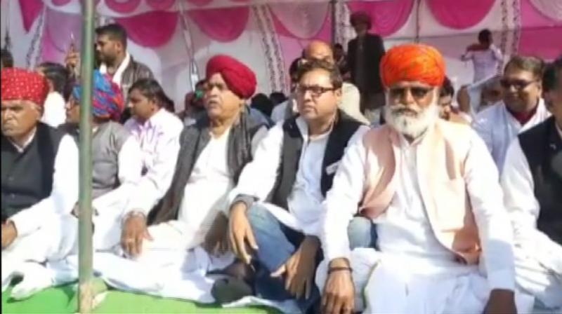 The protestors are demanding five per cent separate reservation to Gujjars, Raika-Rebari, Gadia Luhar, Banjara and Gadaria for government jobs and admission in educational institutions. (Photo: ANI | Twitter) The protestors are demanding five per cent separate reservation to Gujjars, Raika-Rebari, Gadia Luhar, Banjara and Gadaria for government jobs and admission in educational institutions. (Photo: ANI | Twitter)