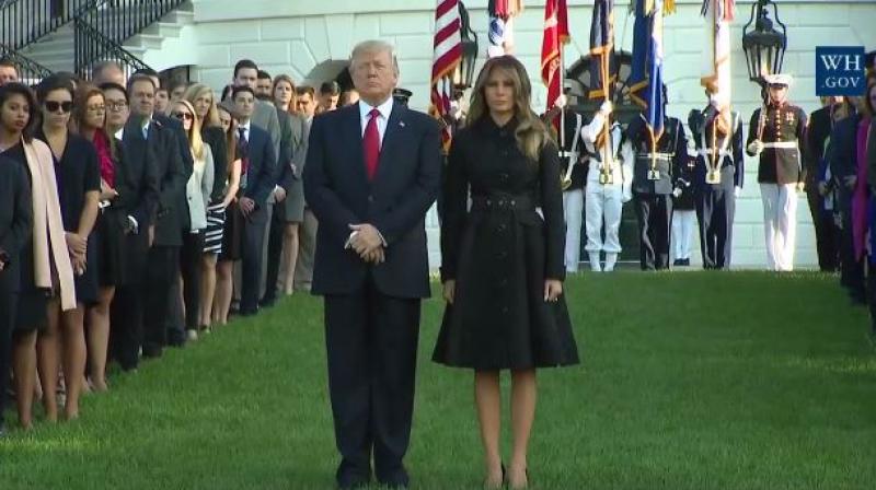 The president, and his wife, Melania, placed their hands on their hearts and bowed their heads as a bell tolled and a Marine played the mournful Taps on a trumpet. (Photo: Facebook) The president, and his wife, Melania, placed their hands on their hearts and bowed their heads as a bell tolled and a Marine played the mournful Taps on a trumpet. (Photo: Facebook)