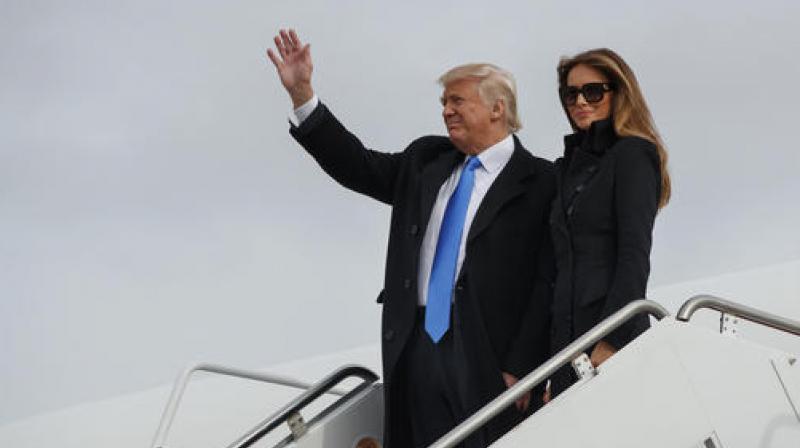 President-elect Donald Trump, accompanied by his wife Melania Trump, waves as they arrive at Andrews Air Force Base. (Photo: AP) President-elect Donald Trump, accompanied by his wife Melania Trump, waves as they arrive at Andrews Air Force Base. (Photo: AP)