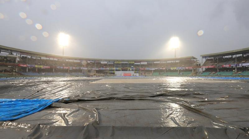 Rain stopped play in the opening Test between India and South Africa here on Wednesday. (Photo:BCCI/Twitter) Rain stopped play in the opening Test between India and South Africa here on Wednesday. (Photo:BCCI/Twitter)