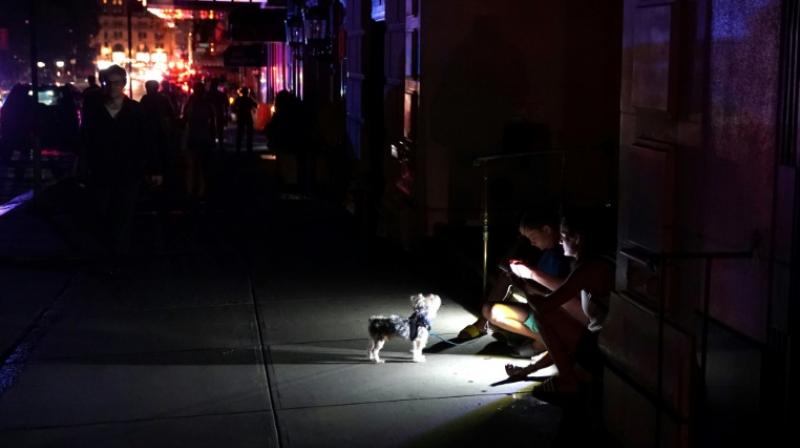 When a massive blackout plunged much of Manhattan into darkness on Saturday evening, a choir and the casts of Broadway musicals entertained tourists with impromptu performances in the street. (Photo: AFP) When a massive blackout plunged much of Manhattan into darkness on Saturday evening, a choir and the casts of Broadway musicals entertained tourists with impromptu performances in the street. (Photo: AFP)