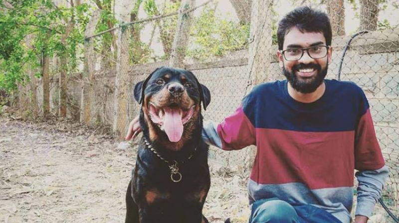 Vivek Anand with a Rottweiler. Vivek Anand with a Rottweiler.