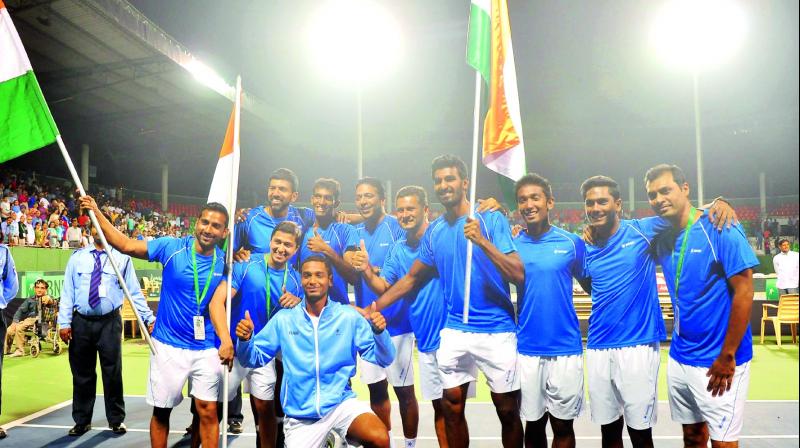 The Indian team celebrate their 3-0 win over Uzbekistan in their Davis Cup Group I Round Two tie in Bengaluru on Saturday. (Photo: SHASHIDHAR B) The Indian team celebrate their 3-0 win over Uzbekistan in their Davis Cup Group I Round Two tie in Bengaluru on Saturday. (Photo: SHASHIDHAR B)