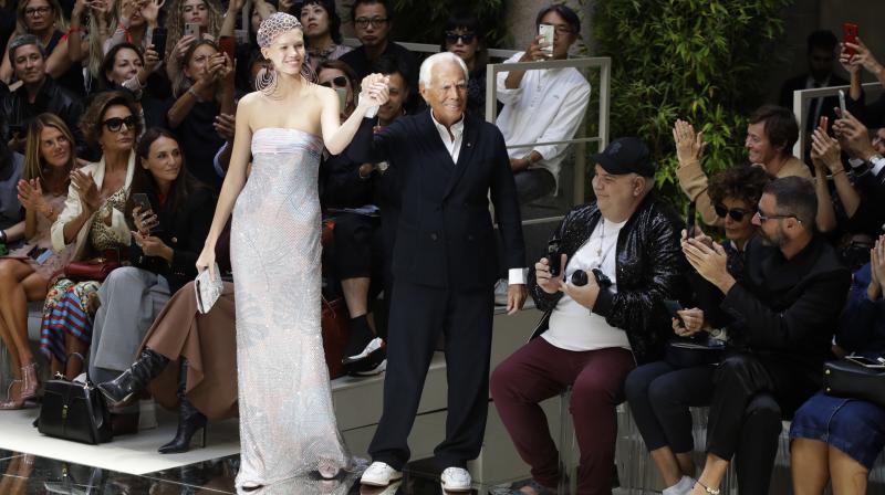 One of the most recognisable names in fashion, Armani, who greeted audiences dressed in a white shirt and dark blazer at the end of the show. (Photo: AP) One of the most recognisable names in fashion, Armani, who greeted audiences dressed in a white shirt and dark blazer at the end of the show. (Photo: AP)
