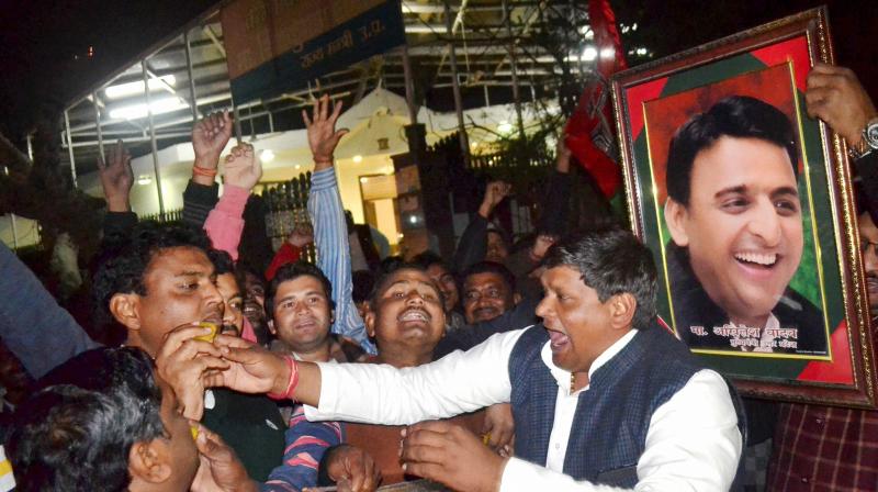 Supporters celebrate in Agra after UP Chief Minister Akhilesh Yadav got the Samajwadi Party symbol, the cycle, and the party name. (Photo: PTI) Supporters celebrate in Agra after UP Chief Minister Akhilesh Yadav got the Samajwadi Party symbol, the cycle, and the party name. (Photo: PTI)