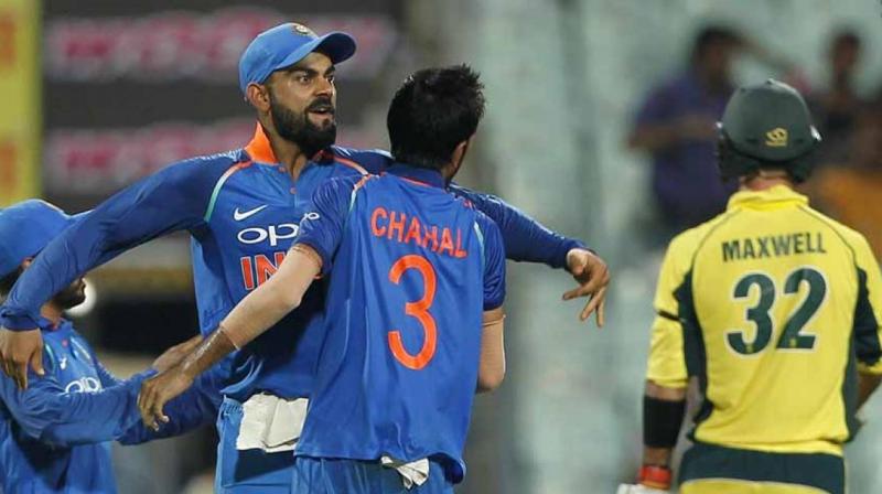 Yuzvendra Chahal celebrates with Virat Kohli after getting Glenn Maxwell's wicket. (Photo: BCCI) Yuzvendra Chahal celebrates with Virat Kohli after getting Glenn Maxwell's wicket. (Photo: BCCI)