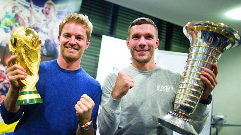 Nico Rosberg, who was recently crowned Formula One champion, and Lukas Podolski, who was part of Joachim Low's World Cup-winning squad in 2014. Nico Rosberg, who was recently crowned Formula One champion, and Lukas Podolski, who was part of Joachim Low's World Cup-winning squad in 2014.