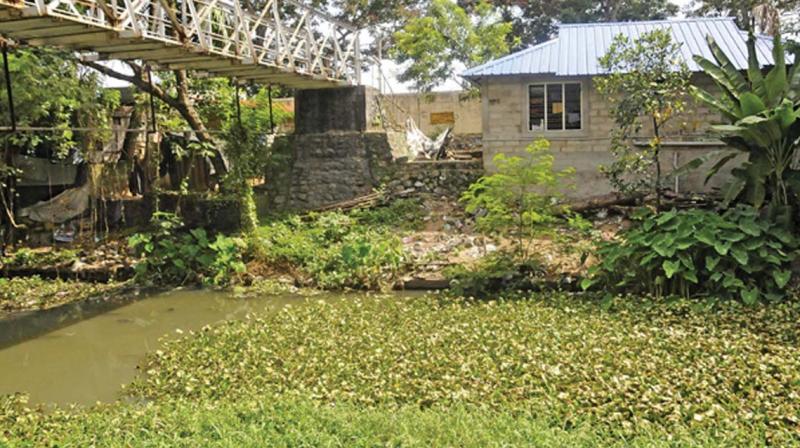 A building located on banks of Parvathy Puthanar (file pic). Encroachments found in survey included three four-storey buildings, political party offices and huts. (Photo:DC) A building located on banks of Parvathy Puthanar (file pic). Encroachments found in survey included three four-storey buildings, political party offices and huts. (Photo:DC)