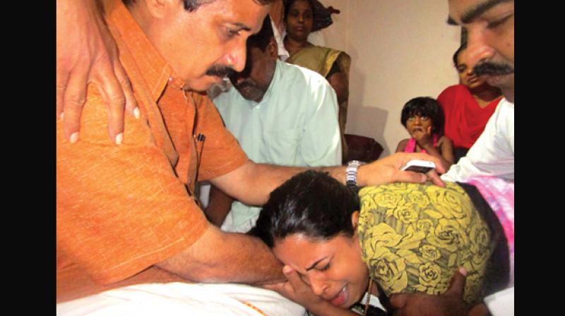 Education minister C. Raveendranath consoles Jishnu Pranoy’s parents. The minister visited Jishnu’s house in Nadapuram in Kozhikode on Thursday. (Photo: DC) Education minister C. Raveendranath consoles Jishnu Pranoy’s parents. The minister visited Jishnu’s house in Nadapuram in Kozhikode on Thursday. (Photo: DC)