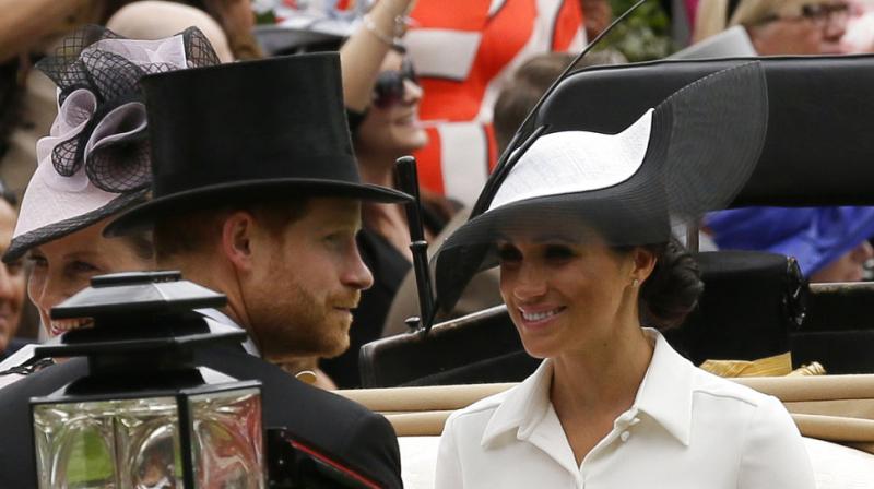 Britain's Prince Harry and Meghan, Duchess of Sussex, arrives at the parade ring with Prince Edward, Earl of Wessex, and Sophie, Countess of Wessex, in a horse drawn carriage on the first day of the Royal Ascot horse race meeting in Ascot. (Photo: AP) Britain's Prince Harry and Meghan, Duchess of Sussex, arrives at the parade ring with Prince Edward, Earl of Wessex, and Sophie, Countess of Wessex, in a horse drawn carriage on the first day of the Royal Ascot horse race meeting in Ascot. (Photo: AP)
