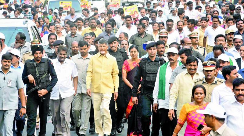 Chief Minister N. Chandrababu Naidu, ministers, NGO leaders and others take out a rally as part of the 4th Nava Nirmana Deeksha on Bandar Road in Vijayawada on Saturday. (Photo: c. narayana rao) Chief Minister N. Chandrababu Naidu, ministers, NGO leaders and others take out a rally as part of the 4th Nava Nirmana Deeksha on Bandar Road in Vijayawada on Saturday. (Photo: c. narayana rao)