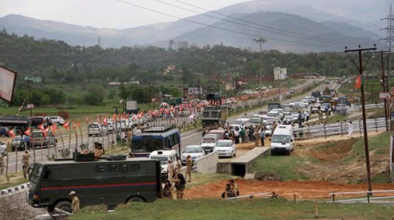 A military vehicle near the Jammu-Srinagar national highway as security has been beefed up ahead of Prime Minister Narendra Modi's visit, in Jammu on Saturday. (Photo: PTI) A military vehicle near the Jammu-Srinagar national highway as security has been beefed up ahead of Prime Minister Narendra Modi's visit, in Jammu on Saturday. (Photo: PTI)