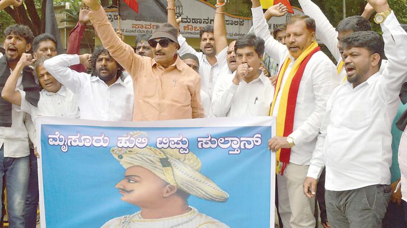 Kannada activist Vatal Nagaraj and his supporters stage a protest against the government for cancelling Tipu Jayanti celebrations, in Bengaluru on Wednesday. Kannada activist Vatal Nagaraj and his supporters stage a protest against the government for cancelling Tipu Jayanti celebrations, in Bengaluru on Wednesday.