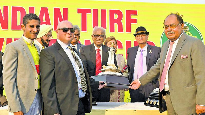 Hyderabad Race Club chairman R. Surender Reddy (centre) presents the winner’s trophy to Breeder Sultan Singh (right), trainer J. E. Mckeown (second from left) and jockey Y. S. Srinath (left) after Adjudicate won the Indian Turf Invitation Cup at the Malakpet Race Course in Hyderabad on Sunday. Hyderabad Race Club chairman R. Surender Reddy (centre) presents the winner’s trophy to Breeder Sultan Singh (right), trainer J. E. Mckeown (second from left) and jockey Y. S. Srinath (left) after Adjudicate won the Indian Turf Invitation Cup at the Malakpet Race Course in Hyderabad on Sunday.