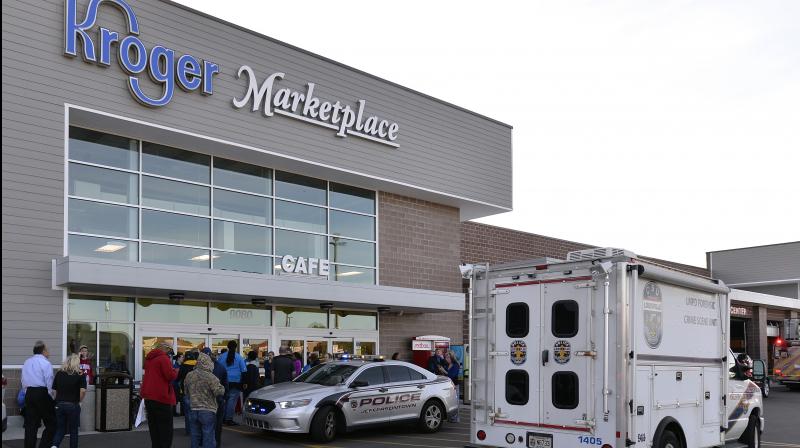 Employees wait outside the entrance of a Kroger grocery following a shooting that left two people dead and a suspect in custody on Wednesday. (Photo: AP) Employees wait outside the entrance of a Kroger grocery following a shooting that left two people dead and a suspect in custody on Wednesday. (Photo: AP)