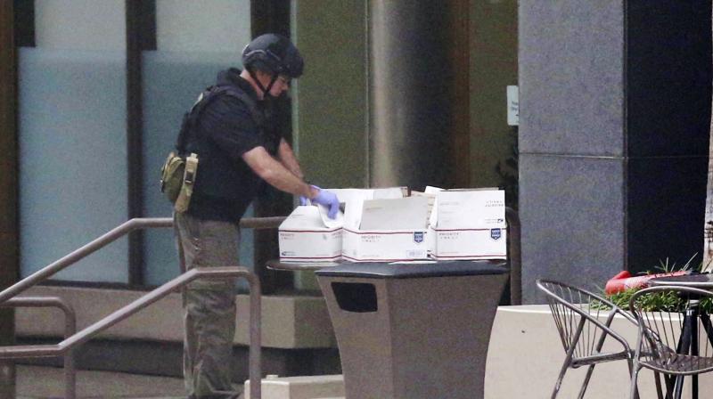The San Diego Fire Rescue department bomb squad looks over a suspicious package on Wednesday. (Photo: AP) The San Diego Fire Rescue department bomb squad looks over a suspicious package on Wednesday. (Photo: AP)