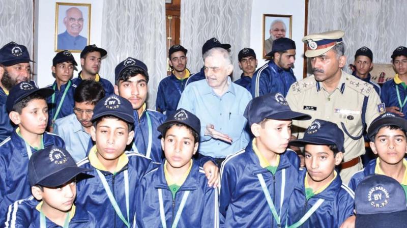 Governor Justice P Sathasivam and Mathew A John, DIG, CRPF, with J&K children visiting Kerala Governor Justice P Sathasivam and Mathew A John, DIG, CRPF, with J&K children visiting Kerala