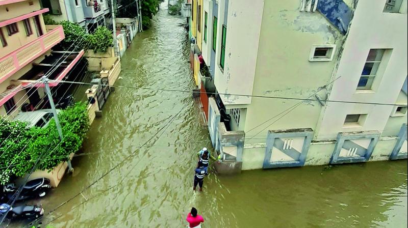 Residents face a slew of troubles from submerged colonies to roads caving in due to rains. (Photos by S. Surender Reddy, P Surendra and Gandhi) Residents face a slew of troubles from submerged colonies to roads caving in due to rains. (Photos by S. Surender Reddy, P Surendra and Gandhi)