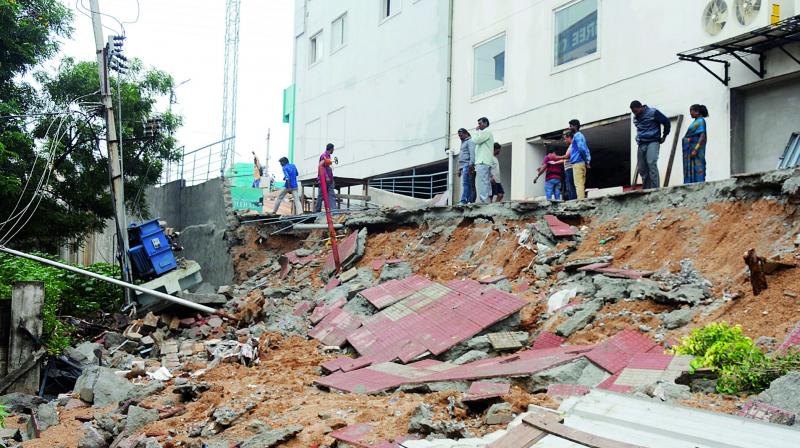 A five-foot wall collapsed on the main electric wires and transformer at ragathinagar causing severe damage. (Deepak Deshpande) A five-foot wall collapsed on the main electric wires and transformer at ragathinagar causing severe damage. (Deepak Deshpande)