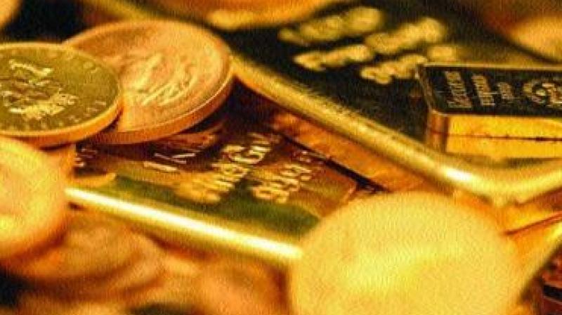 Gold prices slipped on Wednesday after rising for three straight sessions as the dollar held its gains on the back of upbeat US economic data and equities edged up, whetting investor risk appetite. Gold prices slipped on Wednesday after rising for three straight sessions as the dollar held its gains on the back of upbeat US economic data and equities edged up, whetting investor risk appetite.