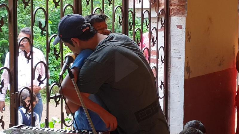 Sushant Singh Rajput with the visually challenged child. Sushant Singh Rajput with the visually challenged child.