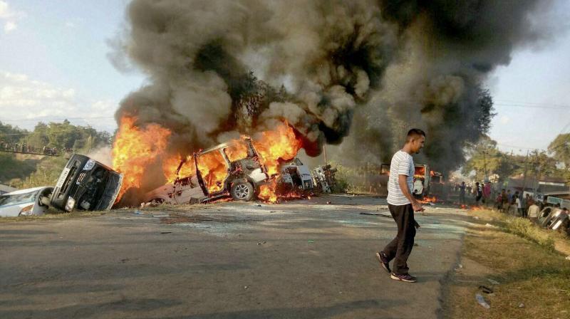 Angry people set on fire vehicles in Imphal East district in protest against the United Naga Council (UNC)'s indefinite economic blockade. (Photo: PTI) Angry people set on fire vehicles in Imphal East district in protest against the United Naga Council (UNC)'s indefinite economic blockade. (Photo: PTI)