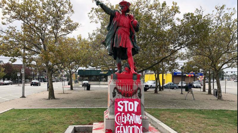 A statue in Providence, Rhode Island, was splashed from head to toe Monday with red paint, and a sign reading "Stop celebrating genocide" was leaned against the pedestal. (Photo: AP) A statue in Providence, Rhode Island, was splashed from head to toe Monday with red paint, and a sign reading "Stop celebrating genocide" was leaned against the pedestal. (Photo: AP)