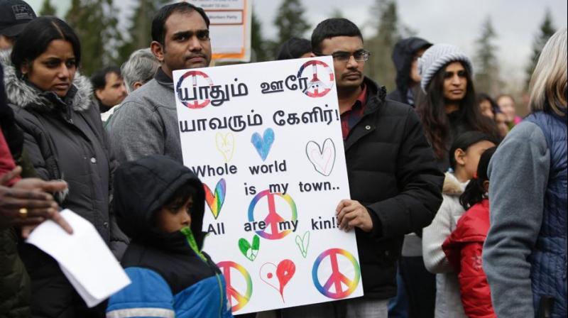 Members of the South Asian community and others attend a peace vigil for Srinivas Kuchibhotla, the 32-year-old Indian engineer killed at a bar Olathe, Kansas, in Bellevue, Washington on March 5, 2017.(Photo: AFP) Members of the South Asian community and others attend a peace vigil for Srinivas Kuchibhotla, the 32-year-old Indian engineer killed at a bar Olathe, Kansas, in Bellevue, Washington on March 5, 2017.(Photo: AFP)