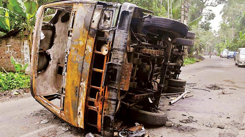 A burnt vehicle seen at a road after a communal riot at Baduria in North 24 Pargana district of West Bengal (Photo: PTI) A burnt vehicle seen at a road after a communal riot at Baduria in North 24 Pargana district of West Bengal (Photo: PTI)