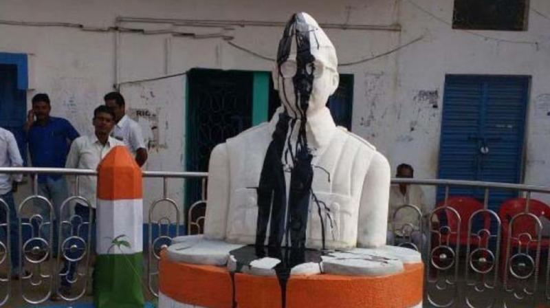 On Tuesday morning when the gate of the panchayat office was opened it was found that the statue was smeared with coal tar and face was partly damaged, the police said. (Photo: ANI/Twitter) On Tuesday morning when the gate of the panchayat office was opened it was found that the statue was smeared with coal tar and face was partly damaged, the police said. (Photo: ANI/Twitter)