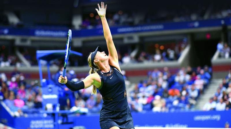 Russia’s Maria Sharapova serves to Sofia Kenin of USA in their third round match at the USTA Billie Jean King National Tennis Center in New York on Friday. Sharapova won 7-5. 6-2 (Photo: AFP) Russia’s Maria Sharapova serves to Sofia Kenin of USA in their third round match at the USTA Billie Jean King National Tennis Center in New York on Friday. Sharapova won 7-5. 6-2 (Photo: AFP)