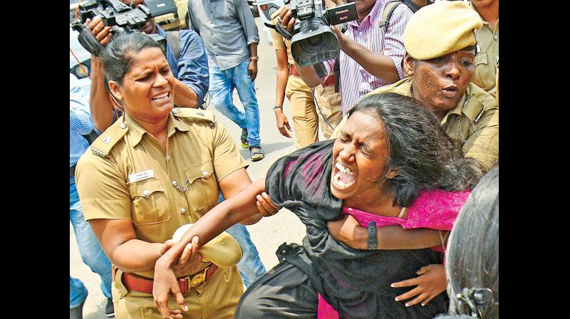 Chennai police arrest Revolutionary Students and Youth Front (RSYF) members near Anna Statue, Anna Salai for agitating following the death of anti-Neet crusader Anitha (Photo: DC) Chennai police arrest Revolutionary Students and Youth Front (RSYF) members near Anna Statue, Anna Salai for agitating following the death of anti-Neet crusader Anitha (Photo: DC)