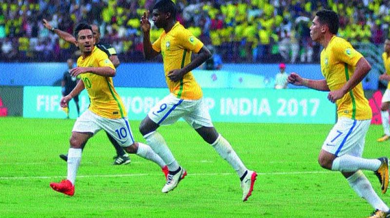 Brazil’s Lincoln (centre) celebrates with team-mates after scoring against Spain in their U-17 World Cup match at the Jawaharlal Nehru Stadium in Kochi on Saturday. Brazil began their campaign with a come-from-behind 2-1 victor (Photo: Sunoj Ninan Mathew) Brazil’s Lincoln (centre) celebrates with team-mates after scoring against Spain in their U-17 World Cup match at the Jawaharlal Nehru Stadium in Kochi on Saturday. Brazil began their campaign with a come-from-behind 2-1 victor (Photo: Sunoj Ninan Mathew)