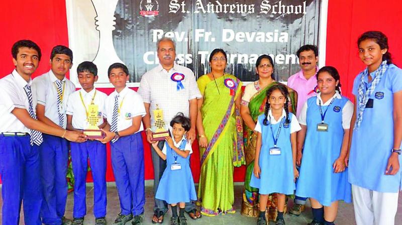 Winners pose with their trophies at the conclusion of the 14th Rev Fr Devasia Inter-School Chess tournament organised by St Andrews School. Winners pose with their trophies at the conclusion of the 14th Rev Fr Devasia Inter-School Chess tournament organised by St Andrews School.