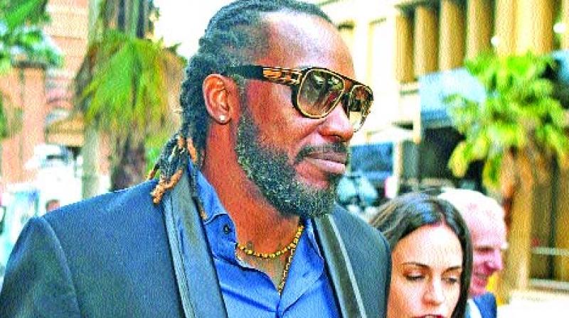 Chris Gayle leaves the NSW Supreme Court after the opening day of his defamation action. (Photo: AFP) Chris Gayle leaves the NSW Supreme Court after the opening day of his defamation action. (Photo: AFP)