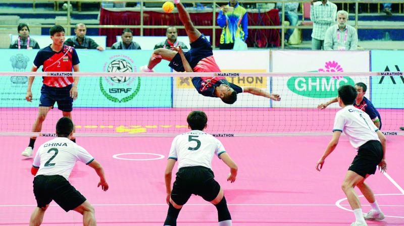 A player from the Indian team smashes during the Sepak Takraw World Cup match against China at the Gachibowli Stadium in Hyderabad on Friday. A player from the Indian team smashes during the Sepak Takraw World Cup match against China at the Gachibowli Stadium in Hyderabad on Friday.