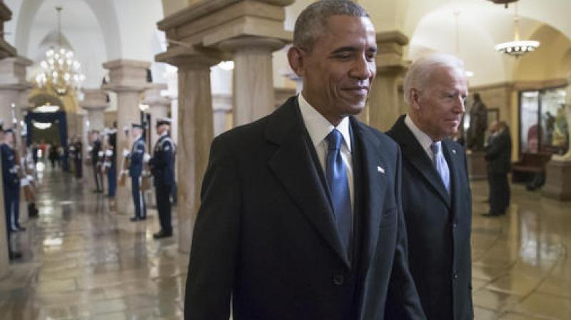 President Barack Obama and Vice President Joe Biden walk through the Crypt of the Capitol for Donald Trump's inauguration ceremony, in Washington. (Photo: AP) President Barack Obama and Vice President Joe Biden walk through the Crypt of the Capitol for Donald Trump's inauguration ceremony, in Washington. (Photo: AP)