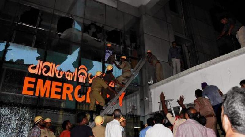 Rescue team in action at SUM Hospital where a fire broke out on Monday night, in Bhubaneswar. (Photo: PTI) Rescue team in action at SUM Hospital where a fire broke out on Monday night, in Bhubaneswar. (Photo: PTI)