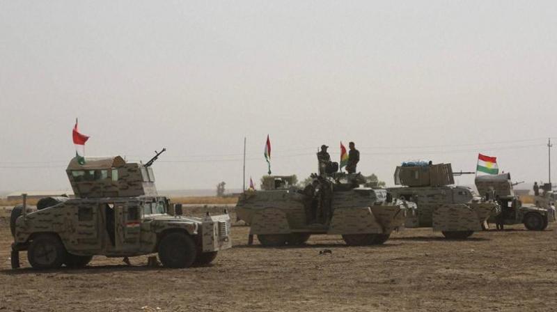 A peshmerga convoy drives towards a frontline in Khazer, about 30 kilometers (19 miles) east of Mosul. (Photo: AP) A peshmerga convoy drives towards a frontline in Khazer, about 30 kilometers (19 miles) east of Mosul. (Photo: AP)