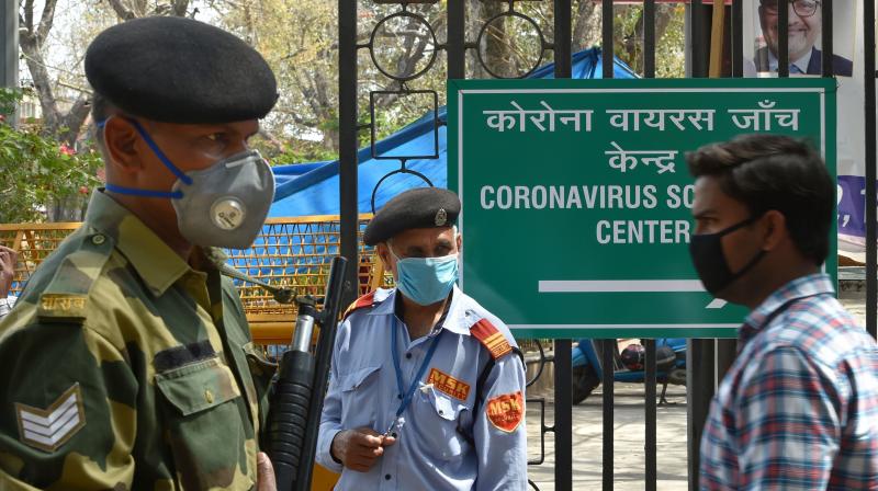 New Delhi: Security personnel stand guard at LNJP hospital as a precaution in the wake of coronavirus pandemic during a nationwide lockdown, in New Delhi. PTI Photo