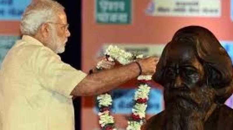Narendra Modi pays his tribute to a bust of Nobel Laureate Rabindra Nath Tagore in 2015. (Photo: PTI) Narendra Modi pays his tribute to a bust of Nobel Laureate Rabindra Nath Tagore in 2015. (Photo: PTI)